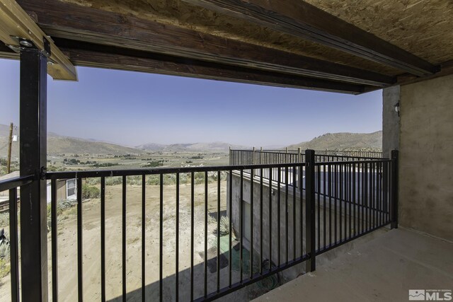 balcony featuring a mountain view