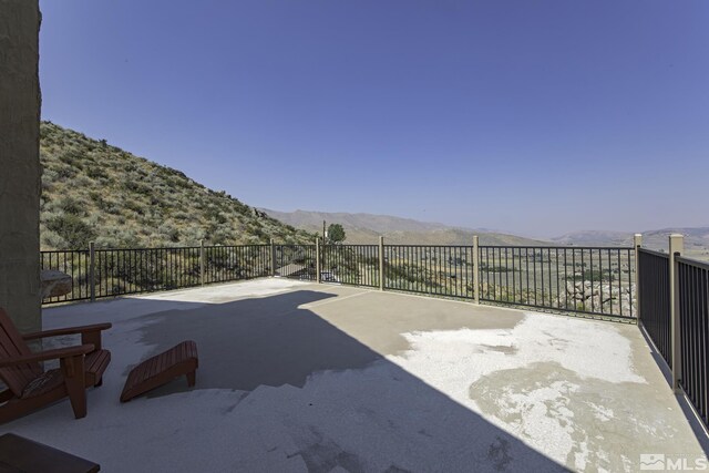 view of patio / terrace with a mountain view