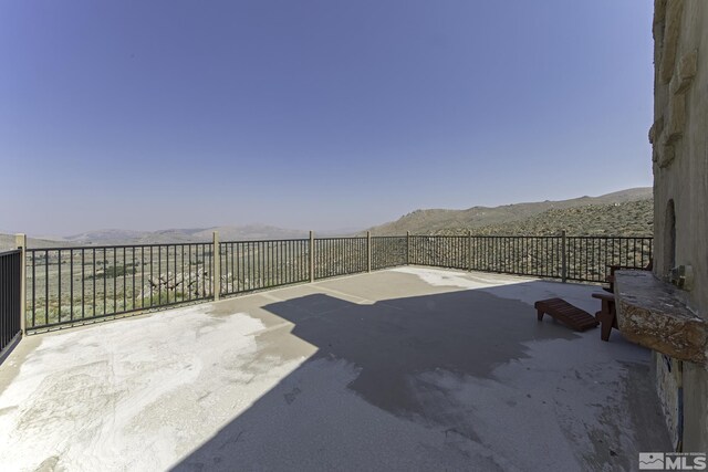 view of patio with a mountain view