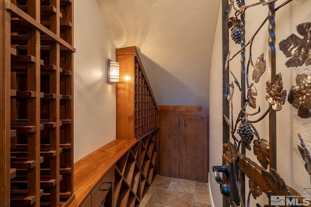 wine room with stone tile flooring