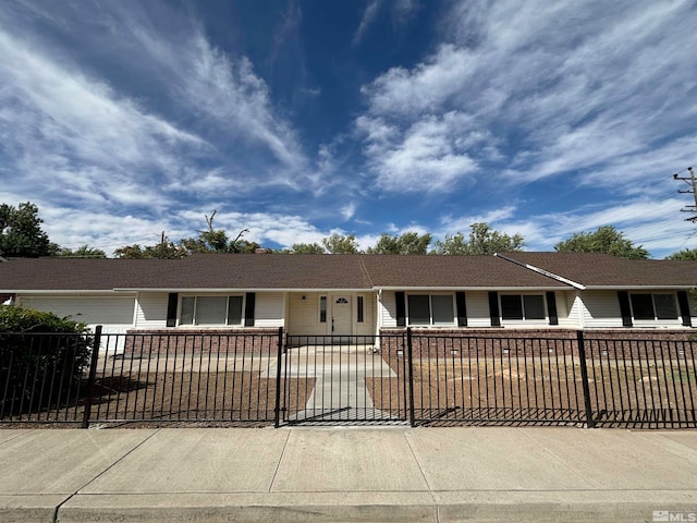 ranch-style house featuring a garage