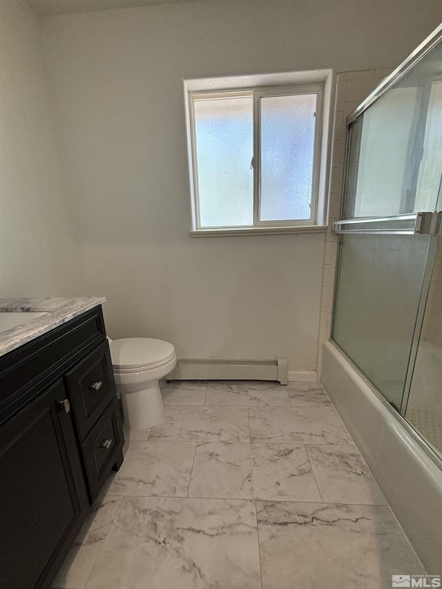 bathroom with a baseboard heating unit, toilet, combined bath / shower with glass door, marble finish floor, and vanity