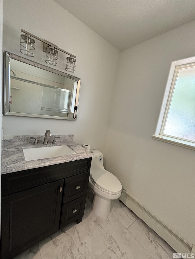 bathroom featuring vanity, baseboards, a baseboard radiator, toilet, and marble finish floor