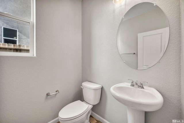 bathroom featuring toilet and sink