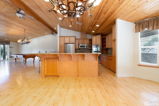 kitchen with light hardwood / wood-style floors, wood ceiling, stainless steel appliances, and pool table