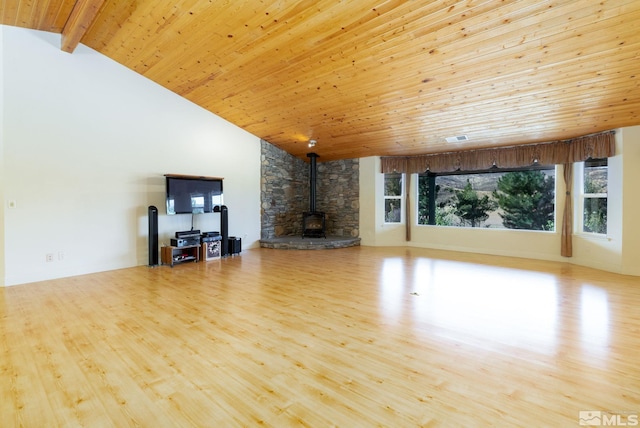 unfurnished living room with wood ceiling, high vaulted ceiling, light hardwood / wood-style flooring, beamed ceiling, and a wood stove