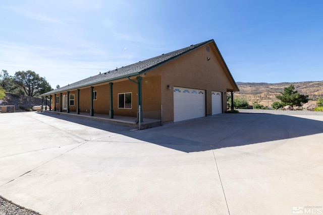 view of side of home with a garage