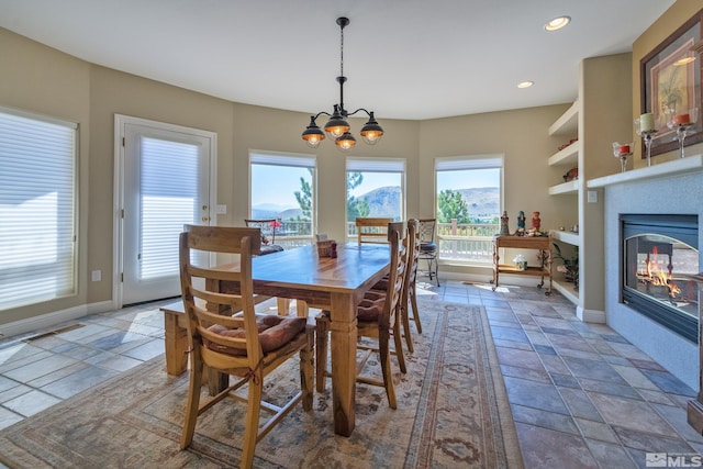 dining space featuring an inviting chandelier