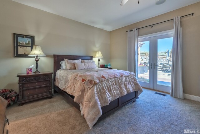 carpeted bedroom featuring ceiling fan, access to exterior, and french doors