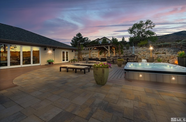 patio terrace at dusk with a pergola