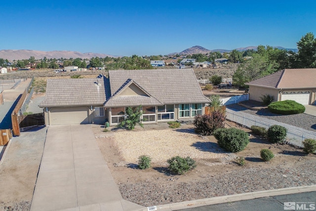 ranch-style house featuring a mountain view and a garage