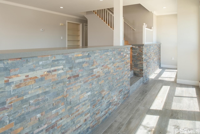 interior space with light wood-type flooring and ornamental molding