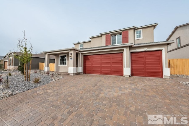 front of property with a garage