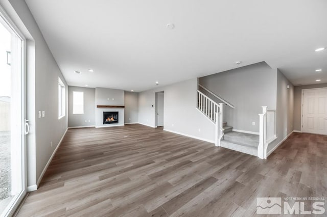 unfurnished living room featuring light hardwood / wood-style floors