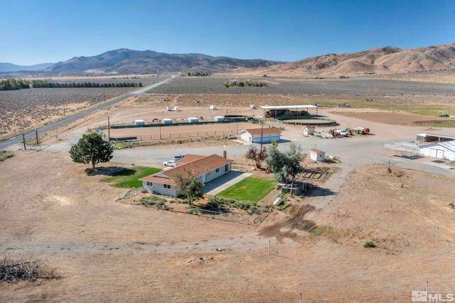 bird's eye view featuring a rural view and a mountain view