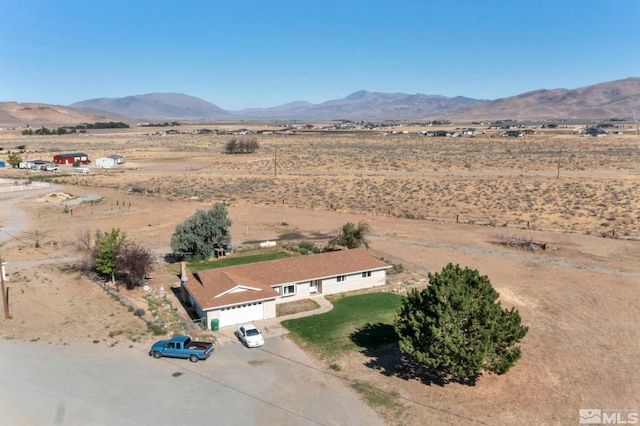 drone / aerial view with a mountain view and a rural view