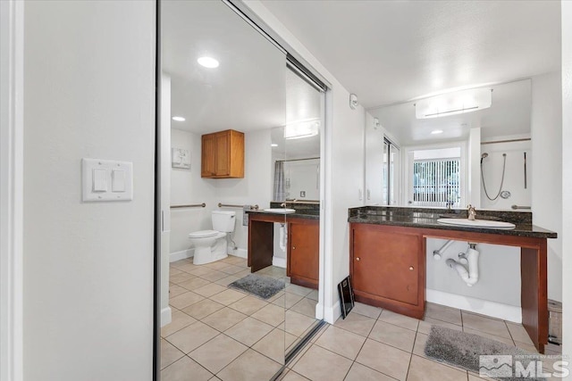 kitchen with light tile patterned flooring and sink