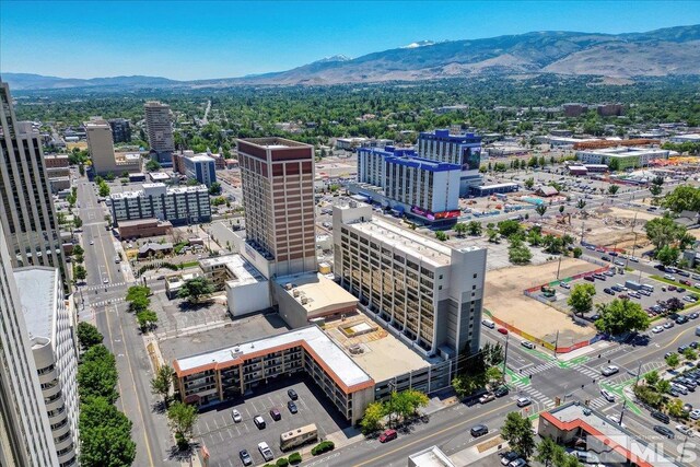 birds eye view of property with a mountain view