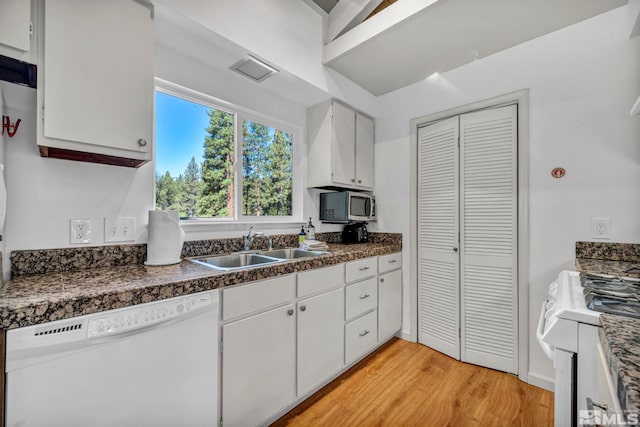 kitchen featuring white appliances, sink, white cabinetry, and light hardwood / wood-style flooring