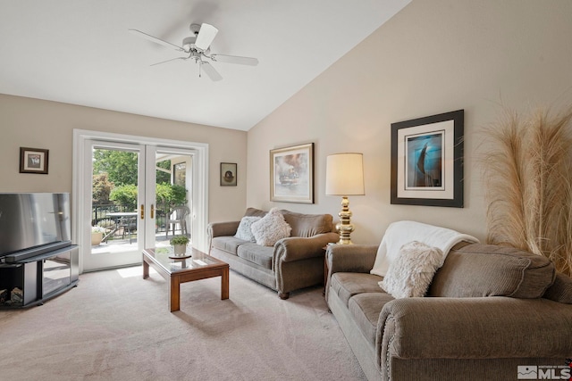 carpeted living room featuring ceiling fan, high vaulted ceiling, and french doors