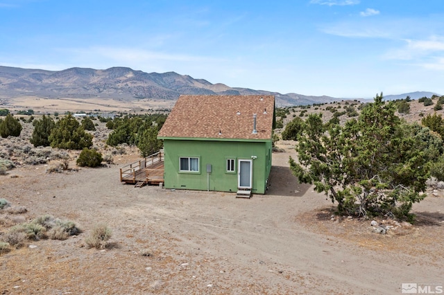 view of home's exterior featuring a mountain view