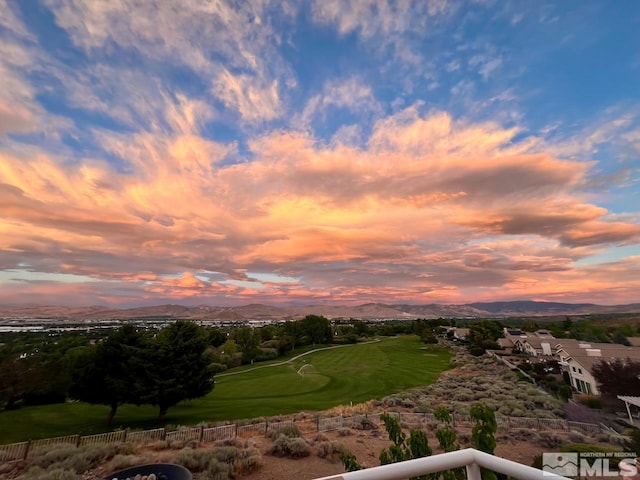 aerial view at dusk featuring a mountain view