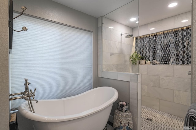 full bathroom featuring a soaking tub and a walk in shower