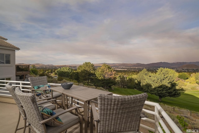 view of patio with a mountain view and a balcony