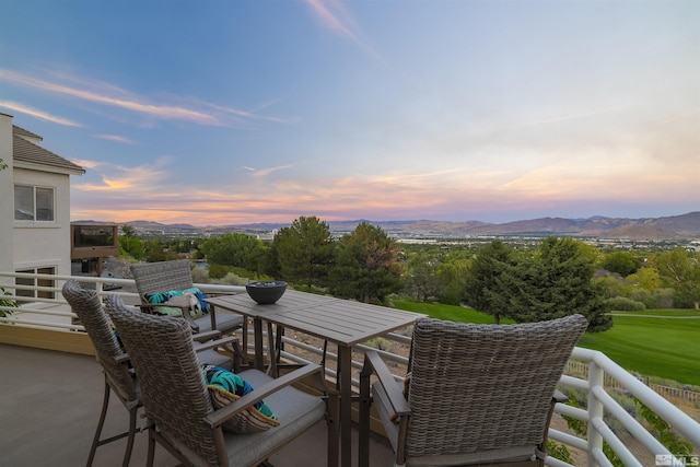 balcony at dusk with a mountain view