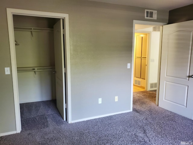 unfurnished bedroom with carpet and a closet