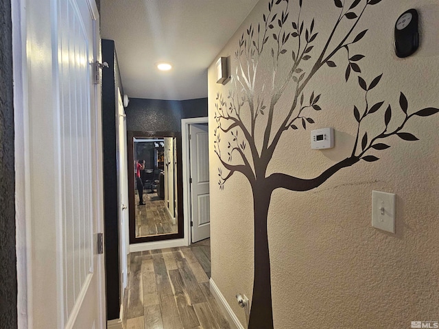 hallway with wood-type flooring