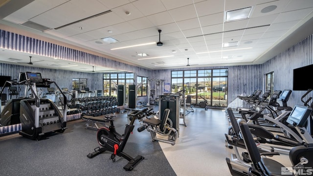 gym with a paneled ceiling