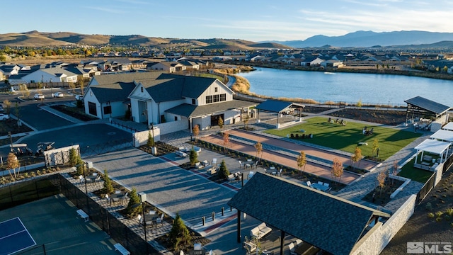 birds eye view of property featuring a residential view and a water and mountain view