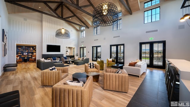 living room with wooden ceiling, light wood-style flooring, french doors, and visible vents