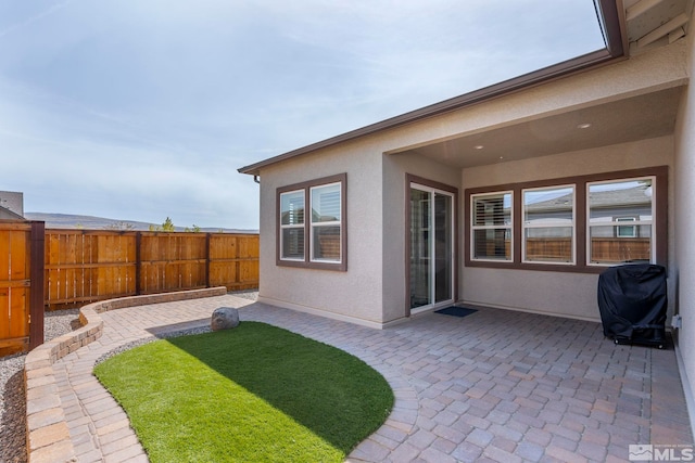 view of yard featuring a patio and fence