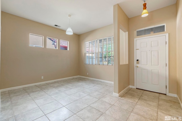 foyer with light tile patterned flooring