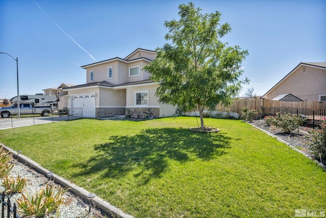 view of front of property featuring a garage and a front yard