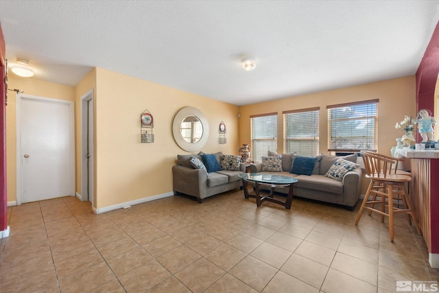 tiled living room with a textured ceiling