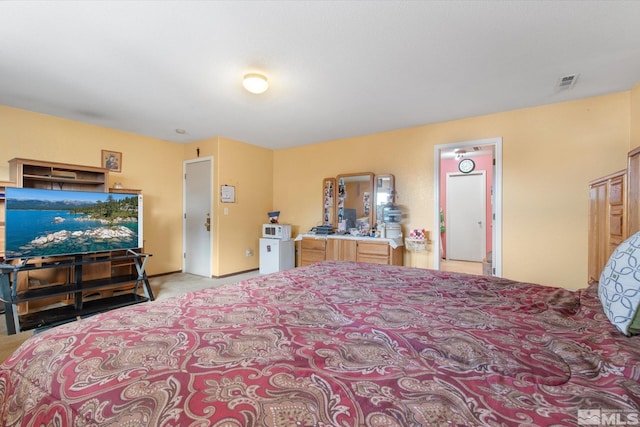 bedroom with light carpet