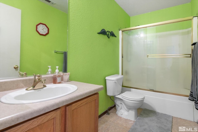 full bathroom featuring vanity, toilet, and combined bath / shower with glass door