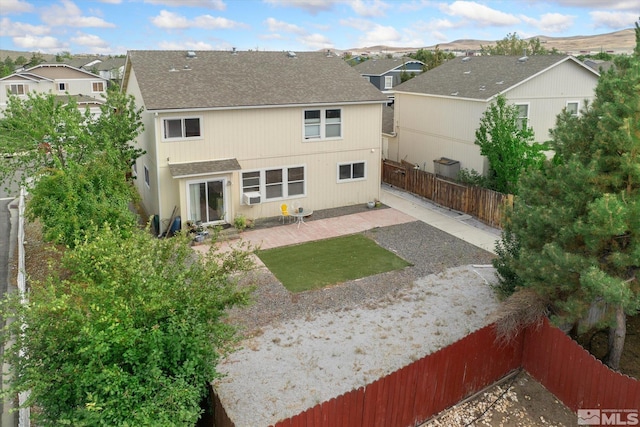 rear view of property with a patio