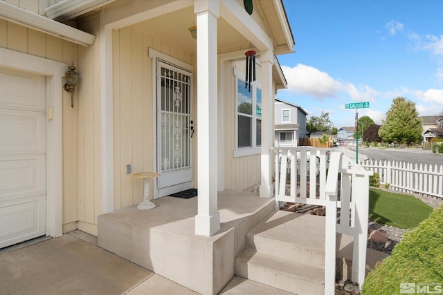 doorway to property featuring covered porch