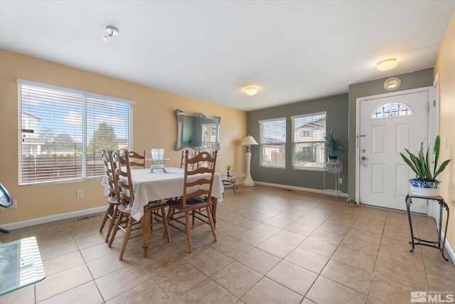 dining area featuring light tile patterned floors