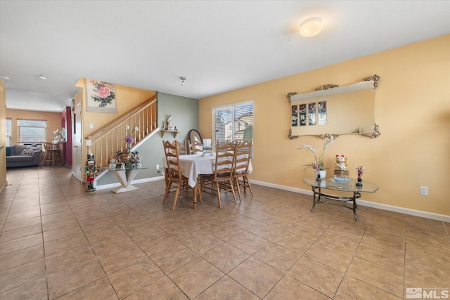 dining room featuring light tile patterned flooring