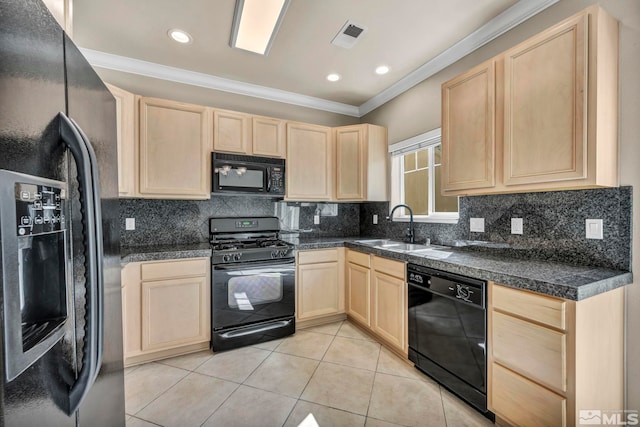 kitchen featuring black appliances, light brown cabinetry, crown molding, and sink