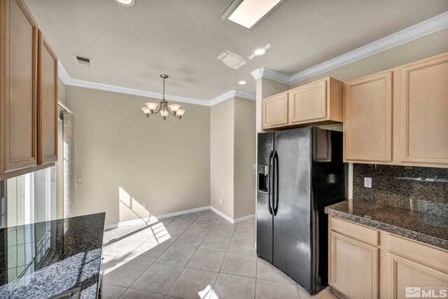 kitchen with light brown cabinetry, a notable chandelier, hanging light fixtures, ornamental molding, and black fridge with ice dispenser