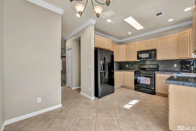 kitchen with black appliances, light brown cabinetry, a notable chandelier, and ornamental molding