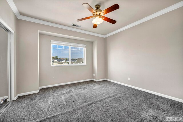 carpeted empty room with ornamental molding and ceiling fan