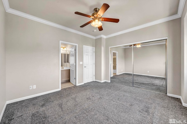 unfurnished bedroom featuring a closet, light carpet, ensuite bath, ornamental molding, and ceiling fan