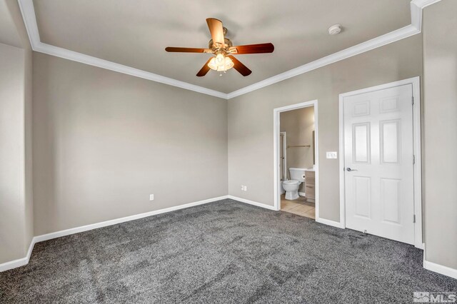 unfurnished bedroom with crown molding, carpet flooring, ceiling fan, and ensuite bath